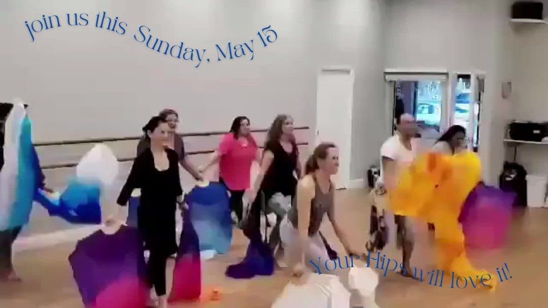 Students dancing with silk veils in class